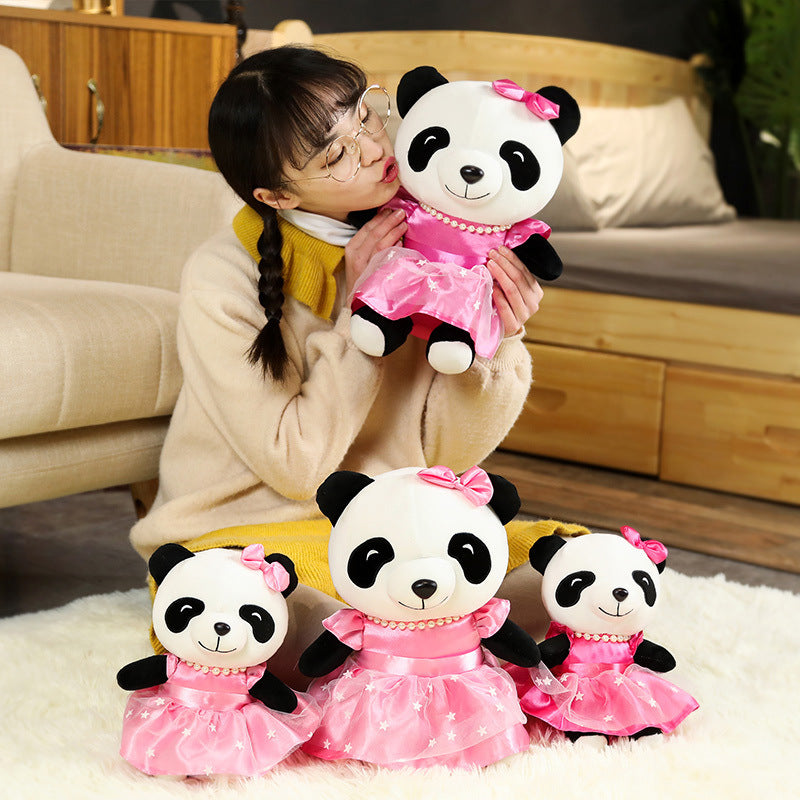 Kawaii portant des jouets en peluche mignons de poupée de panda de jupe